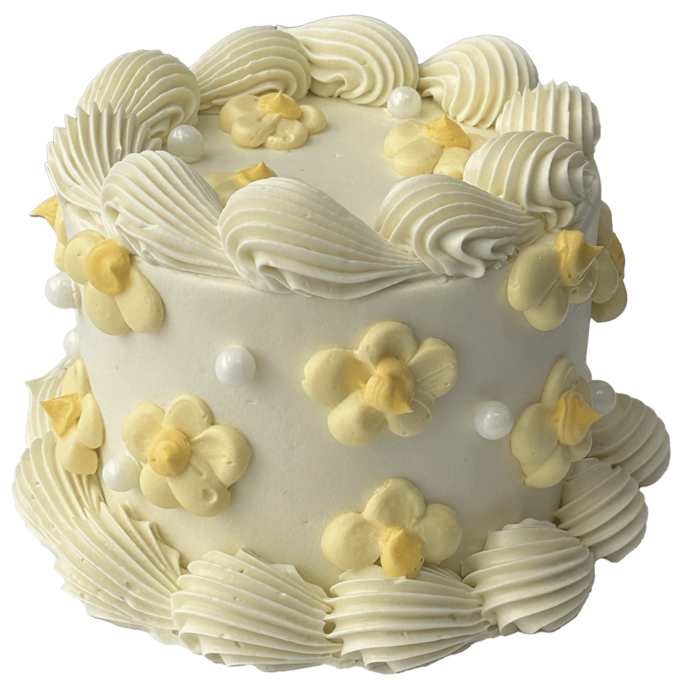  A small mini round shaped Swiss meringue buttercream cake with a white base colour and white piped shells.  Pretty yellow daisies have been piped on the top and sides of the cake and some sugar pearls added to complete the decoration.