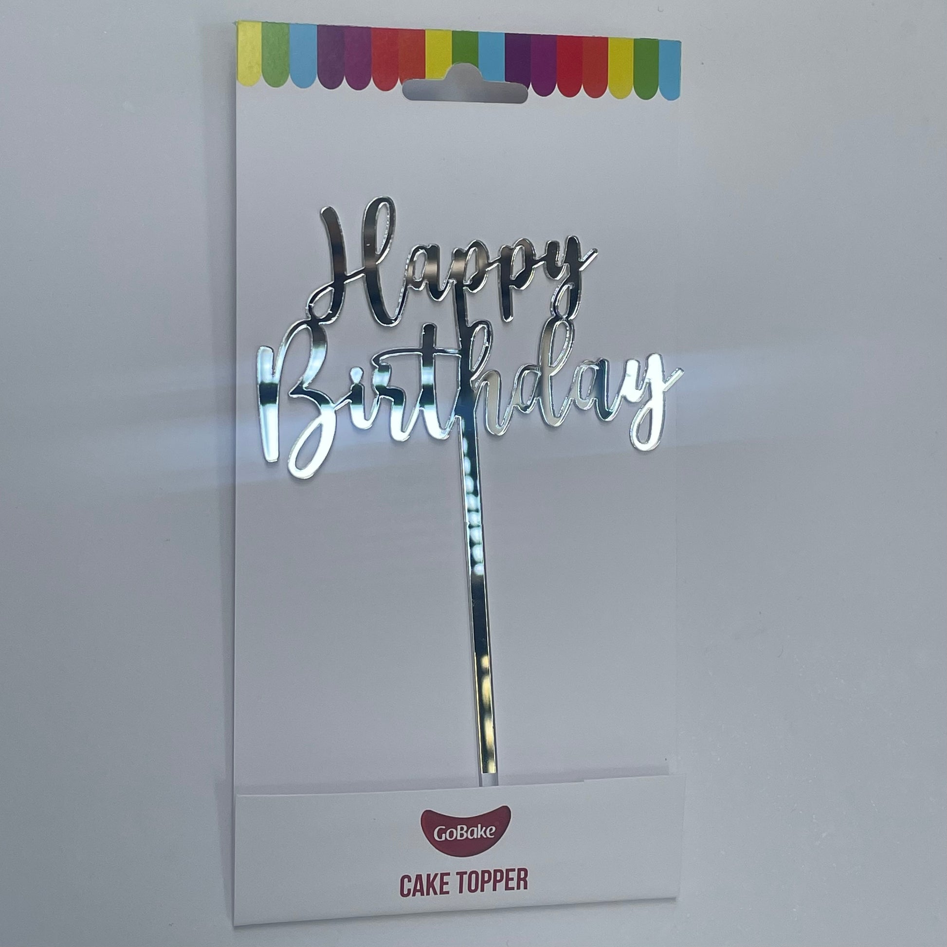 An acrylic cake topping saying Happy Birthday to add to your cake.