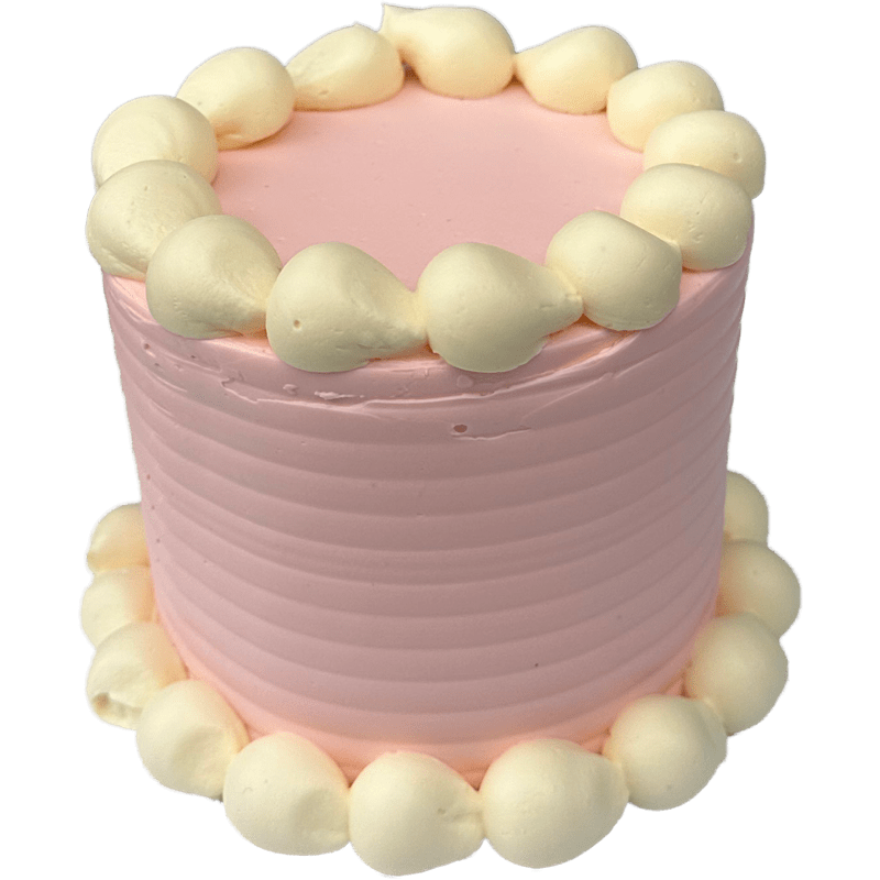A small round shaped four inch cake coated in a pastel pink swiss meringue buttercream with white bubble piping around the bottom and top of the cake. 